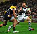 Harlequins' Mike Brown powers towards the line
