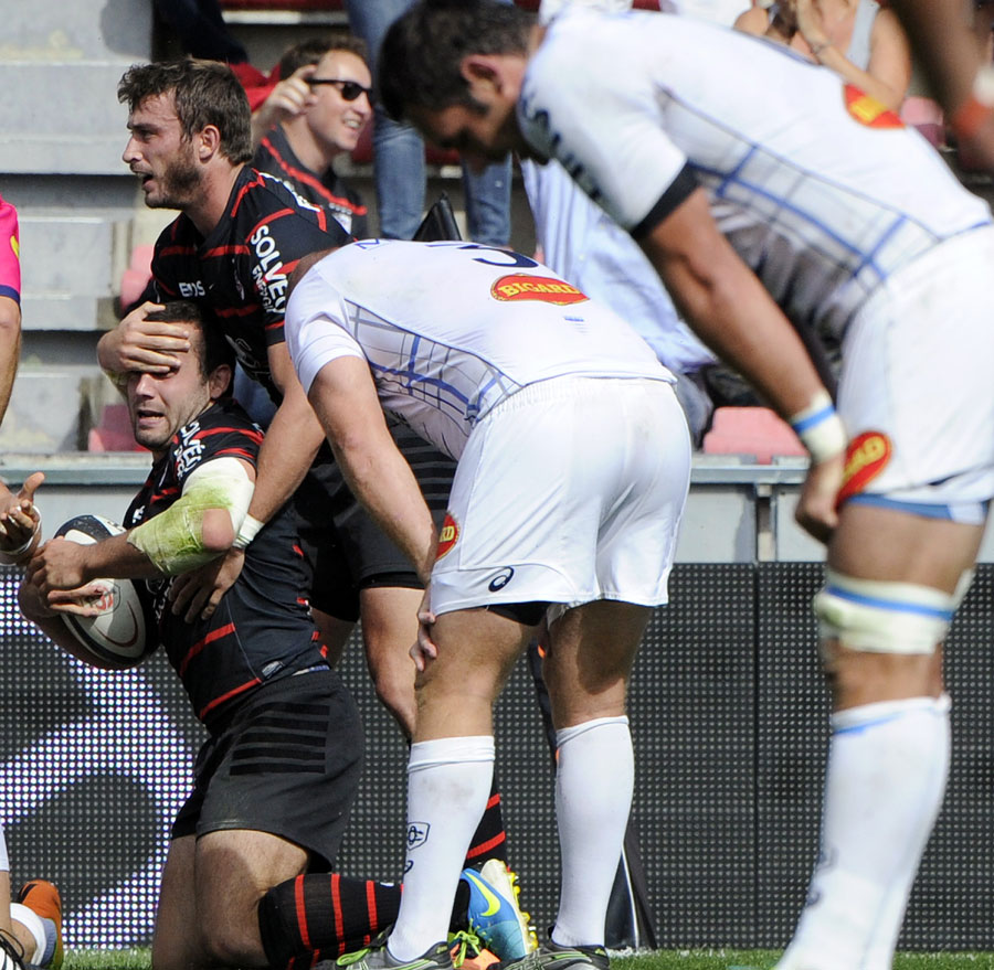 Toulouse's Jean Marc Doussain is congratulated on a try