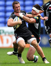 Exeter's Sam Hill is tackled by London Irish's Eamonn Sheridan