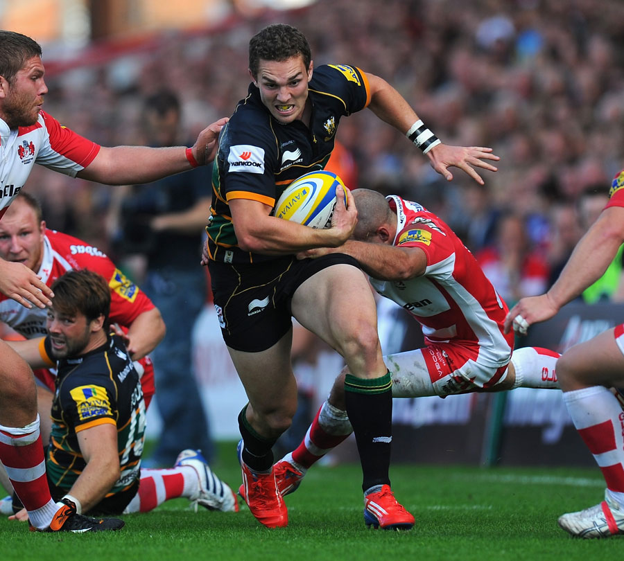Northampton's George North powers through the Gloucester defence