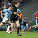 New Zealand's Ben Smith breaks clear to score a try