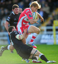 Gloucester's Billy Twelvetrees rides a tackle