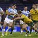 Argentina's Juan Imhoff breaks a tackle from Australia's Michael Hooper