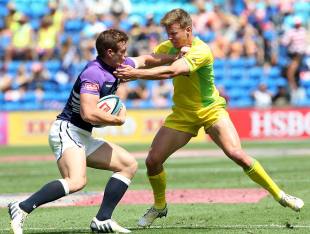 Scotland's Michael Fedo clashes with Australia's Cameron Clark during their first round match at the IRB World Sevens Series, Skilled Park, Gold Coast, Australia, October 12, 2013