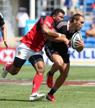New Zealand's Joe Webber is tackled by Tonga's Tasi Ma'u during their first round match at the IRB Sevens World Series rugby tournament, Skilled Park, Gold Coast, Australia, October 12, 2013