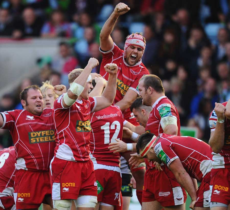 The Scarlets celebrate their win over Harlequins
