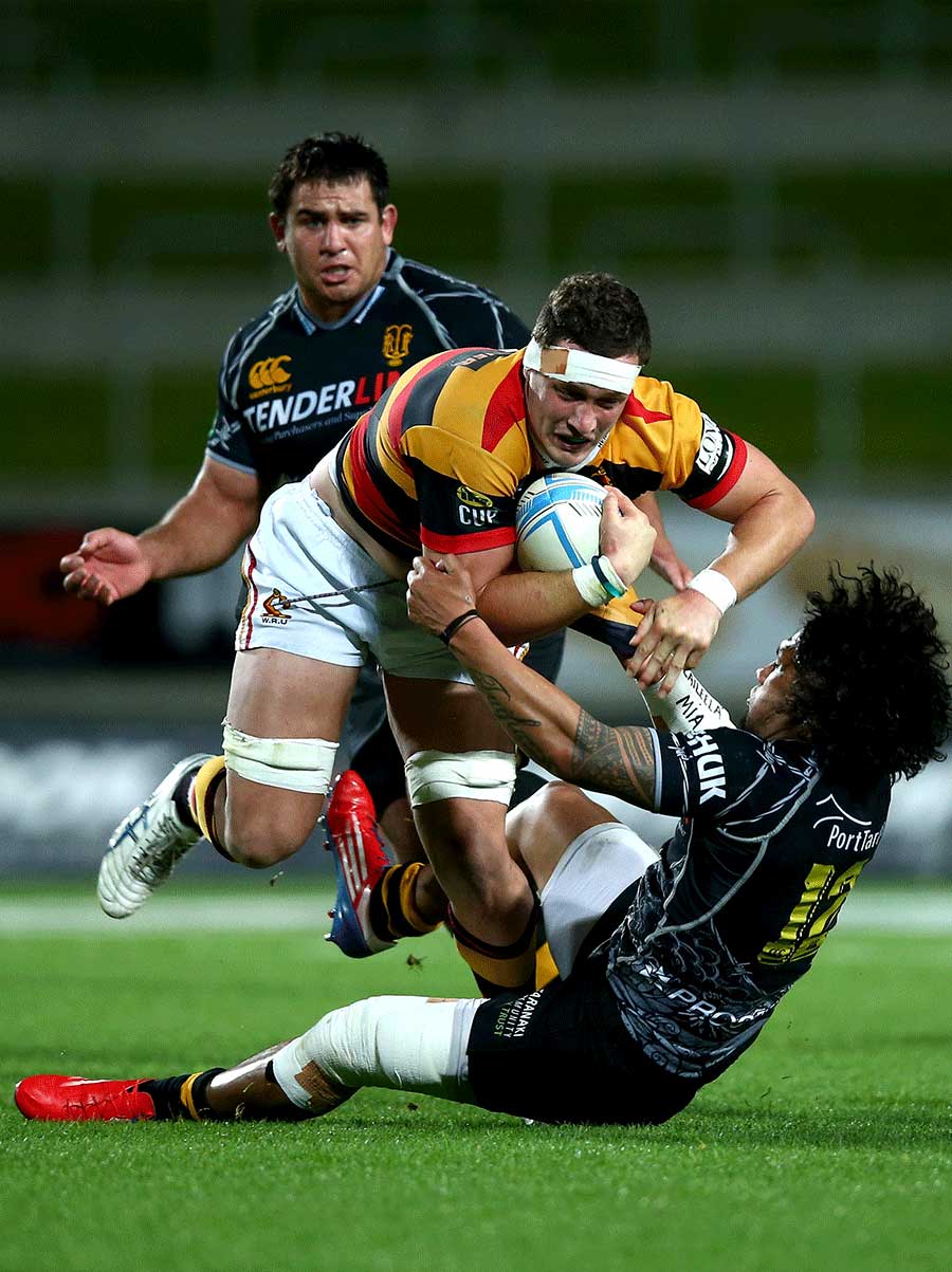 Waikato's Rory Grice is tackled by Taranaki's Isaia Tuifua