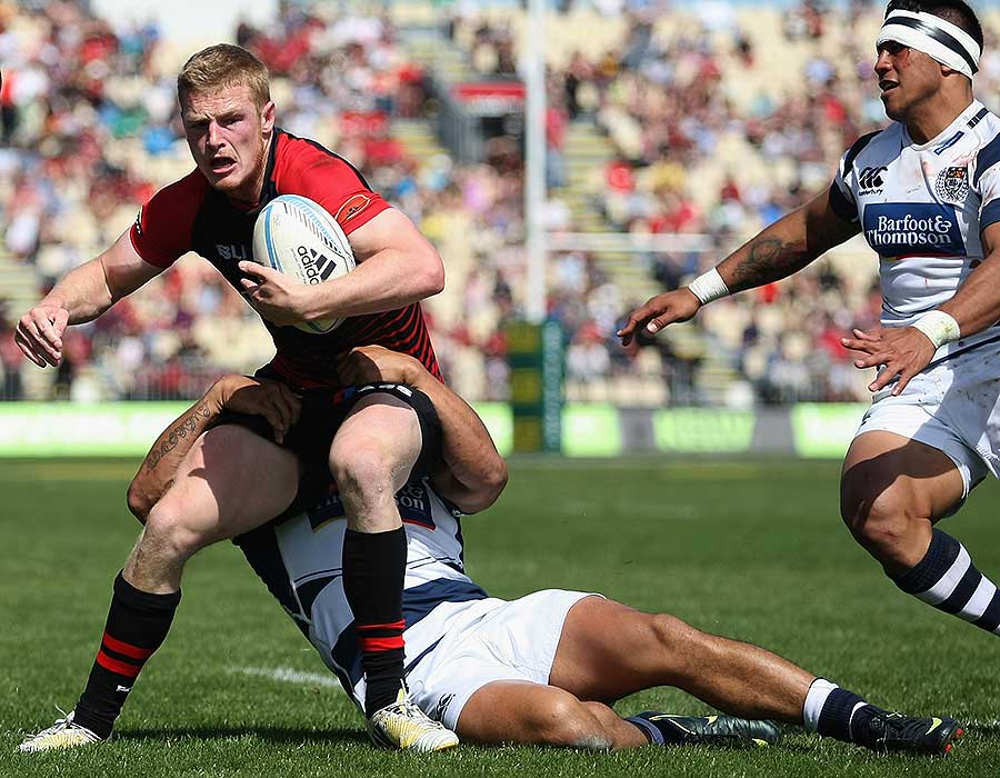 Canterbury's Johnny McNicholl steps out of the tackle of Auckland's George Moala
