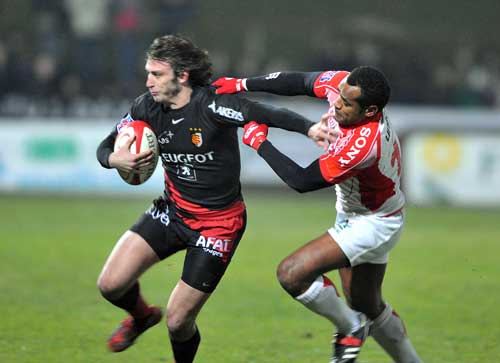 Toulouse fullback Maxime Medard powers forward against Dax