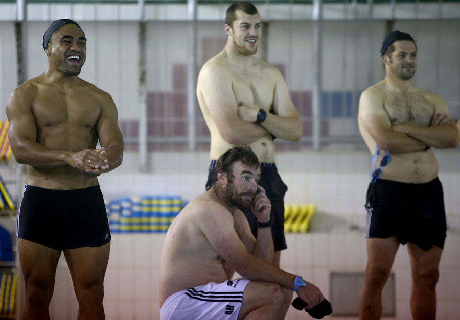 Francis Saili, Andrew Hore, Brodie Retallick and Richie McCaw look on during a pool recovery session