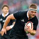 New Zealand's  Sam Cane runs in for a try