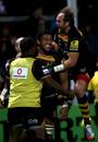 Wasps' Nathan Hughes is mobbed by Andy Goode