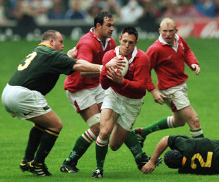 Mark Taylor  runs with the ball against South Africa at the opening of the ground, Millennium Stadium, June 26, 1999