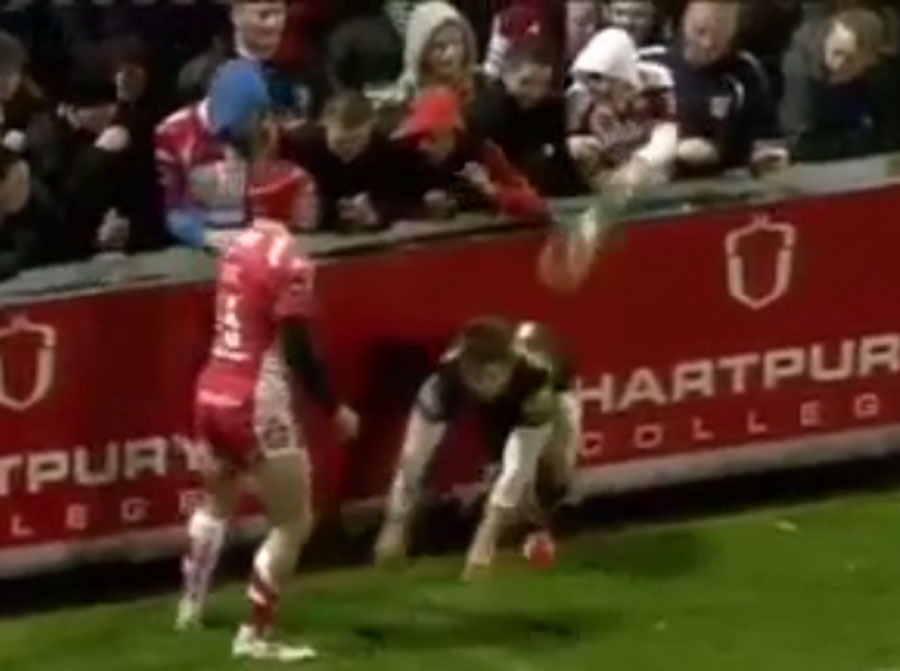 Elliot Daly has beer thrown over him by a Gloucester supporter