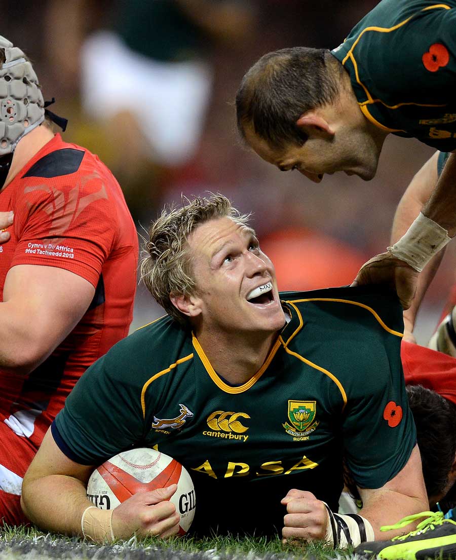 South Africa's Jean de Villiers enjoys his try