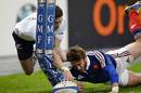 New Zealand's Cory Jane loses the ball under pressure from France's Maxime Medard