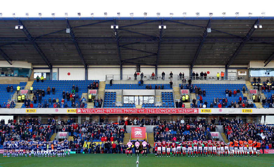 The  London Welsh and  Bristol teams stand for a minute's silence