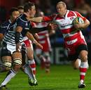 Mike Tindall tries to force his way past Justin Ives