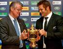 New Zealand's Richie McCaw returns the Webb Ellis Cup to International Rugby Board chairman Bernard Lapasse
