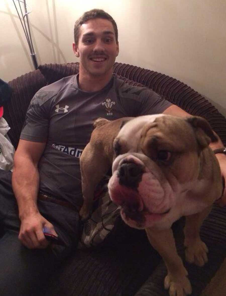George North shows off the new Wales change kit with the help of his dog