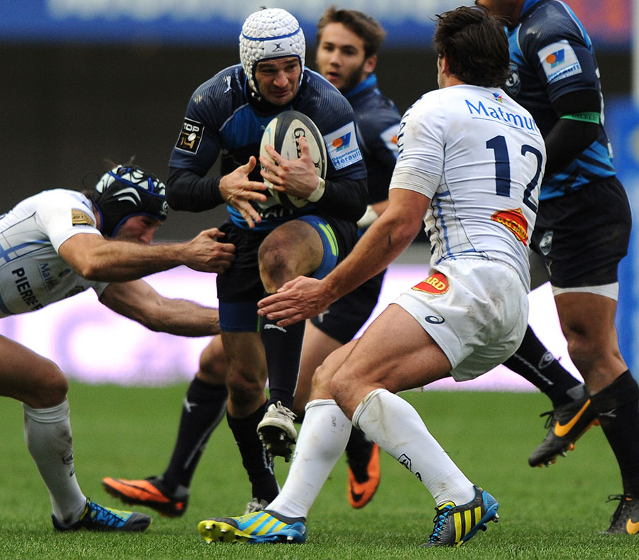 Montpellier's Yoan Audrin takes the ball into contact against Castres