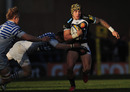 Exeter's Jack Nowell tries to escape the attention of Sarries hands