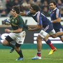 South Africa's Jaque Fourie breaks away from Wesley Fofana