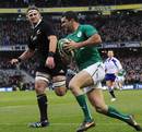 Ireland's Rob Kearney darts over for their third try