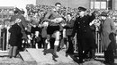 Wales captain Brian Price leads his team out