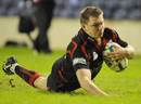 Edinburgh's Andrew Kelly dives over to score try