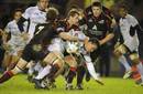 Castres' Christopher Masoe is tackled by the Edinburgh defence