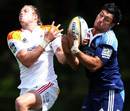 The Chiefs' Tim Mikkelson competes for a high ball with the Blues' Rene Ranger