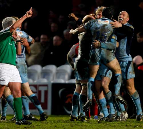 Cardiff Blues players celebrate their win over Gloucester