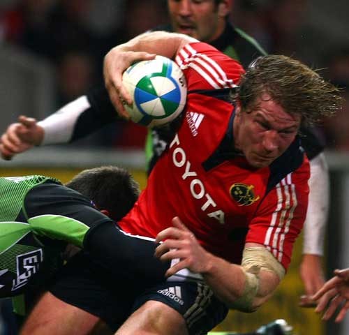 Munster hooker Jerry Flannery is tackled