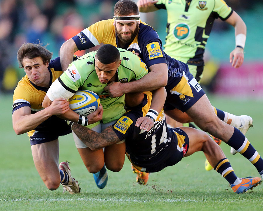 Northampton's Luther Burrell tries to escape the attentions of three Worcester Warriors