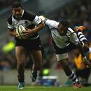Charles Piutau of the Barbarians takes on the Fiji defence