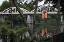 A giant Chiefs Super Rugby replica jersey hangs from a bridge to mark the launch of the jumper