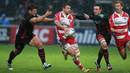 Gloucester's Henry Trinder looks to shift the ball on