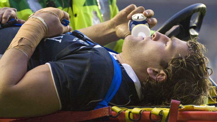 Rory Lamont is stretchered from the field