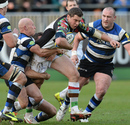 Tim Molenaar tries to power out of a tackle from Bath's Peter Stringer