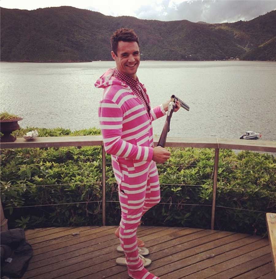 Dan Carter ushers in the New Year with a spot of clay pigeon shooting in a rather striking 'onesie' 