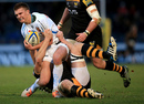 Henry Slade of Exeter is tackled by Joe Launchbury at Adams Park 