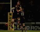 Andy Goode is mobbed by Wasps team-mates after securing a win over Exeter with final kick