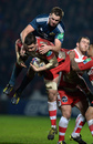 Munster's Dave Foley and Elliott Stooke of Gloucester tussle in the air