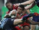 Toulon's David Smith is wrapped up by the Blues