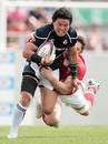 Japan's Harumichi Tatekawa runs the ball