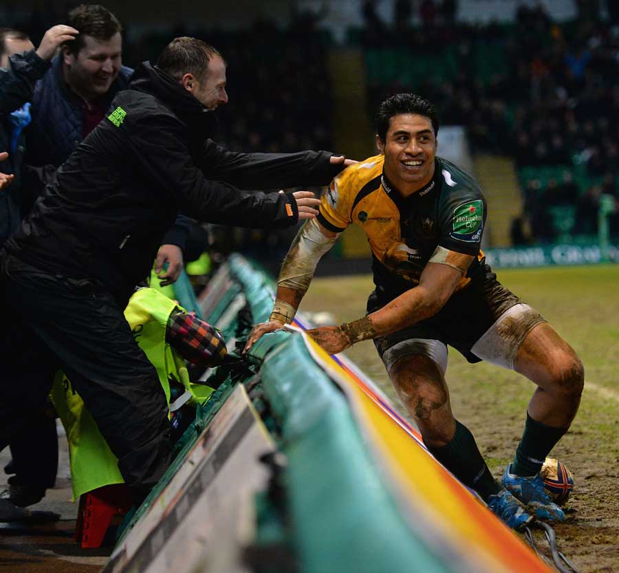 George Pisi is congratulated on his try