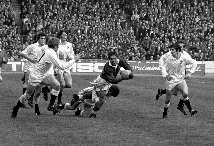 France's Rene Benesis is tackled by England's Peter Knight