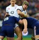 England's Jack Nowell is halted by the French defence