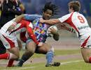 Stade Francais centre Mathieu Bastareaud is tackled by Ulster scrum-half Paul Marshall